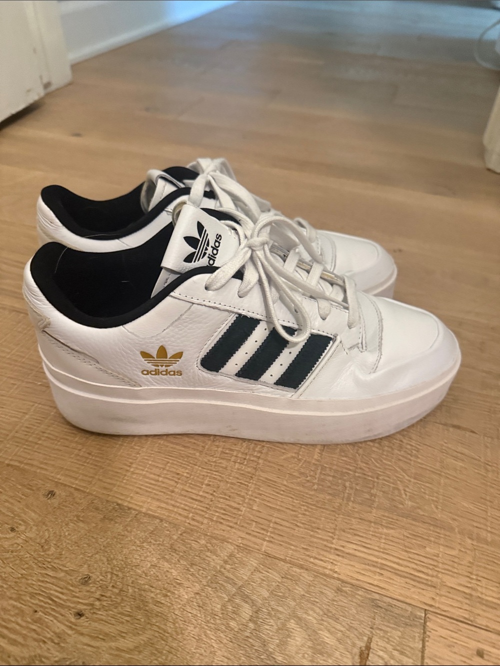 adidas White Sneakers with Black Stripes and Gold Logo